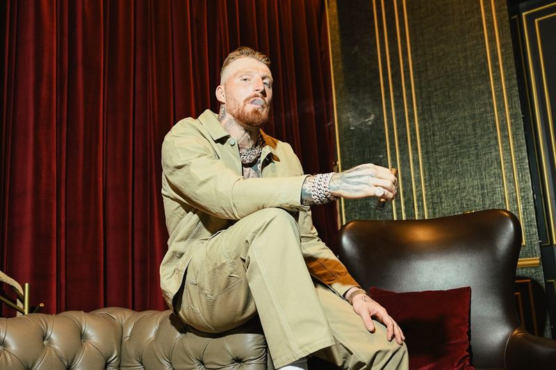 Maxx Crosby with a cigar at EIGHT lounge